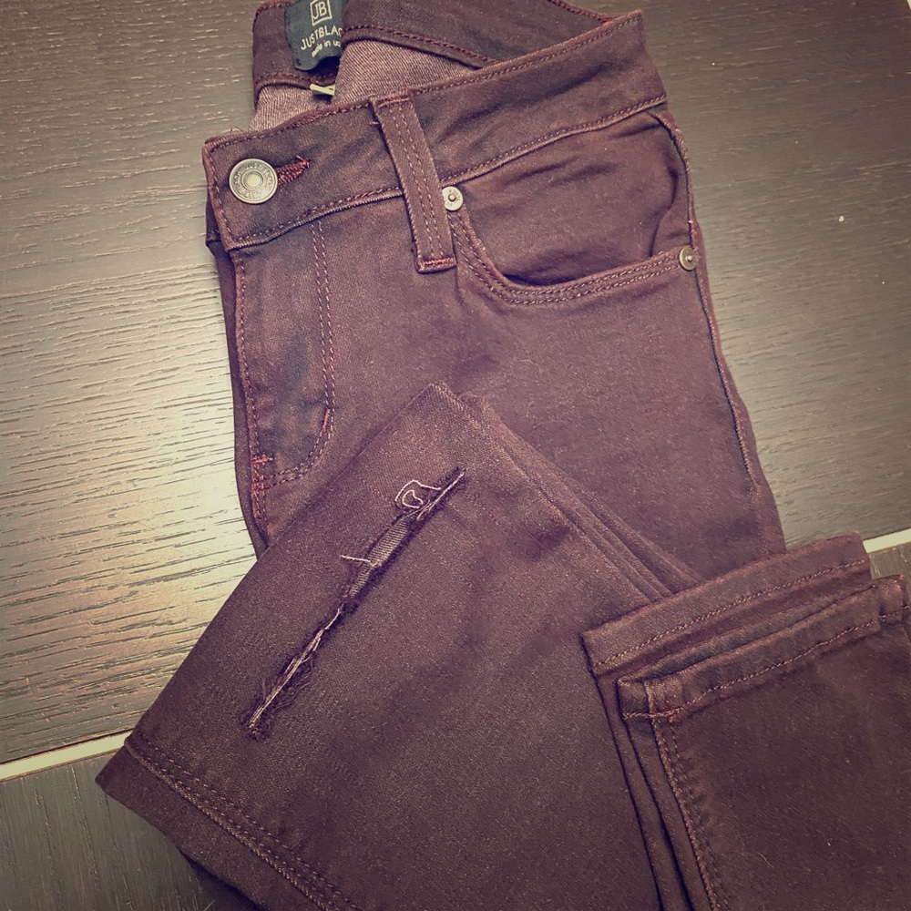 Wine Colored skinny jeans with a slit in the knee